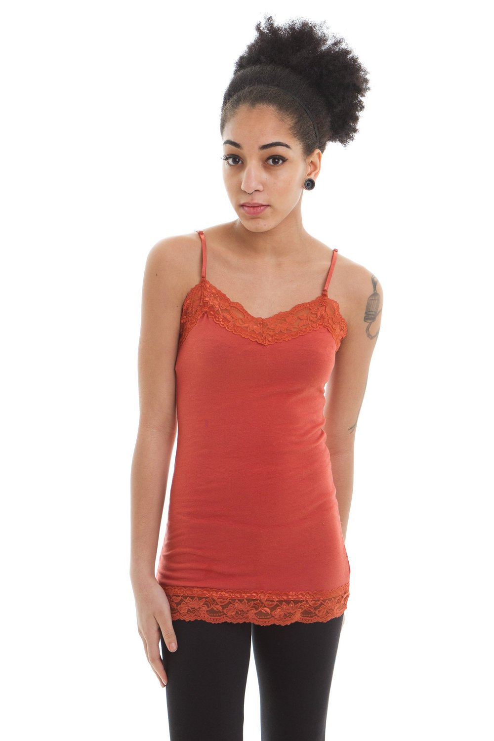 Lace Trim Camis And nothing says “girly girl” better than lace camisoles. Often made with a touch of spandex so they provide a stretch fit that molds to your curves, lace camisoles are the ultimate statement in femininity and timeless romance. Most lace camisoles are semi-sheer, showing just enough skin to be sexy without being over-the-top sheer.